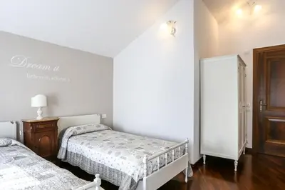 Letto o letti in una camera di La Dimora di Lara B&B