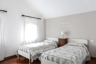Letto o letti in una camera di La Dimora di Lara B&B