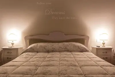 Letto o letti in una camera di La Dimora di Lara B&B