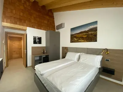 Letto o letti in una camera di Agrialloggio Cantina Piccolin
