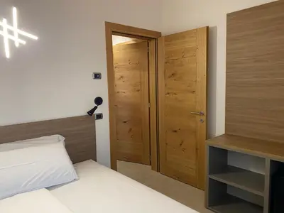 Letto o letti in una camera di Agrialloggio Cantina Piccolin