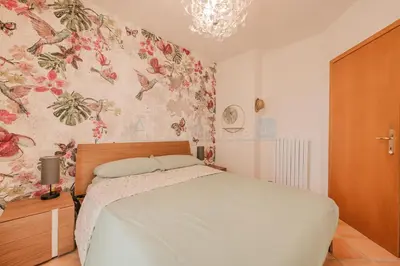 Letto o letti in una camera di Residence Le Vignole Mare