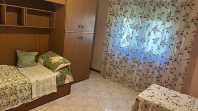 Letto o letti in una camera di Casa Benvenuto
