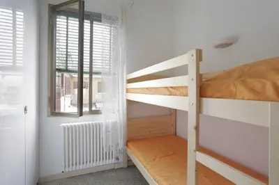 Letto o letti in una camera di Lana - LOCAPPART