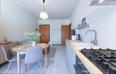 Cucina o angolo cottura di Casa Origine, appartamento vista piscina, al mare