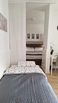 Letto o letti in una camera di Centro Stazione