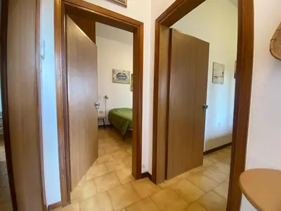 Letto o letti in una camera di Jesolo Via Gozzi