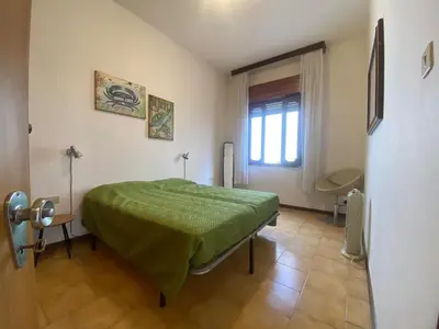 Letto o letti in una camera di Jesolo Via Gozzi