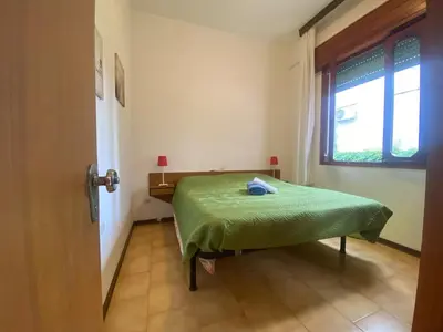 Letto o letti in una camera di Jesolo Via Gozzi