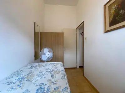 Letto o letti in una camera di Jesolo Via Gozzi