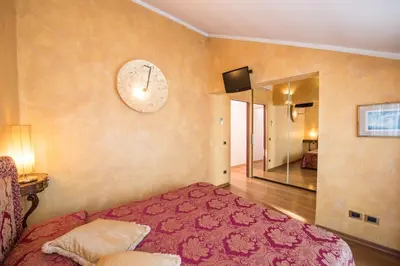 Letto o letti in una camera di Savoia & Jolanda Apartments 2