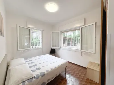 Letto o letti in una camera di Intera casa, 100 m dal mare, grande giardino