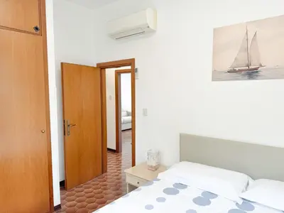 Letto o letti in una camera di Intera casa, 100 m dal mare, grande giardino