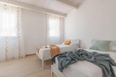 Letto o letti in una camera di San Francesco Harmony Home