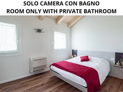 Letto o letti in una camera di Ca' Mia - Casa Belfiore