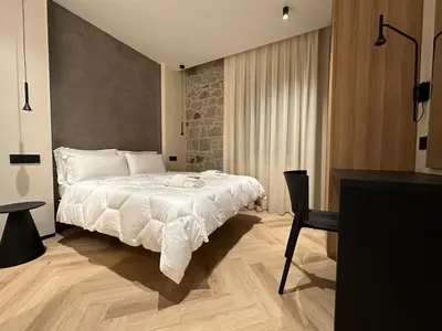 Letto o letti in una camera di De Rerum Natura