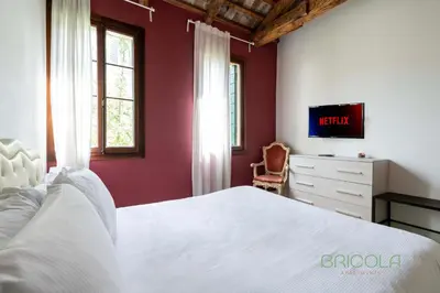 TV o dispositivi per l'intrattenimento presso Biennale Ensuite Rooms By Bricola Apartments