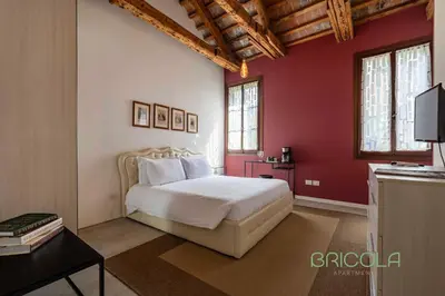 Letto o letti in una camera di Biennale Ensuite Rooms By Bricola Apartments
