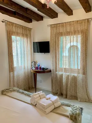 Letto o letti in una camera di B&B Fortuny