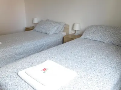 Letto o letti in una camera di Casa Patavina