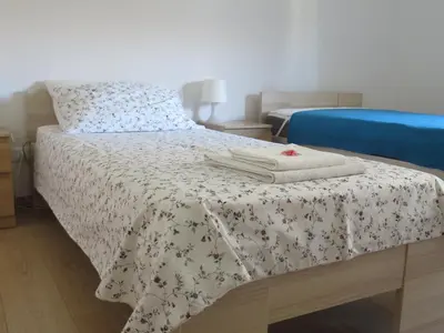 Letto o letti in una camera di Casa Patavina