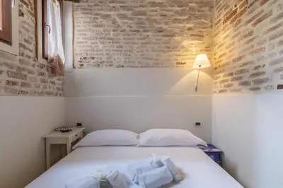 Letto o letti in una camera di Casa Rugheta - Dorsoduro