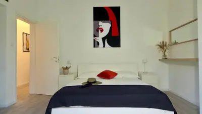 Letto o letti in una camera di GIGI HOUSE - appartamento PIAZZA MAZZINI - 200m dal mare CON POSTO SPIAGGIA