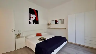 Letto o letti in una camera di GIGI HOUSE - appartamento PIAZZA MAZZINI - 200m dal mare CON POSTO SPIAGGIA