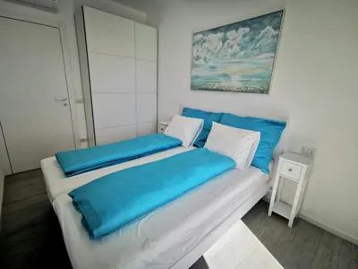 Letto o letti in una camera di Piscina Fronte Mare & Terrazza - JL Blue Apartments C25