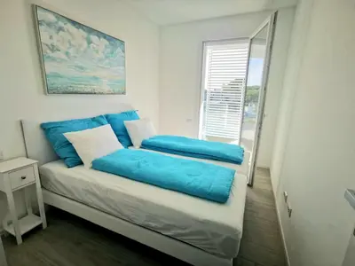 Letto o letti in una camera di Piscina Fronte Mare & Terrazza - JL Blue Apartments C25