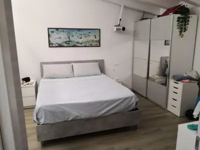 Letto o letti in una camera di Via Vecchia 66
