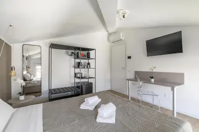 Letto o letti in una camera di Cima Suite 16 by WelcHome