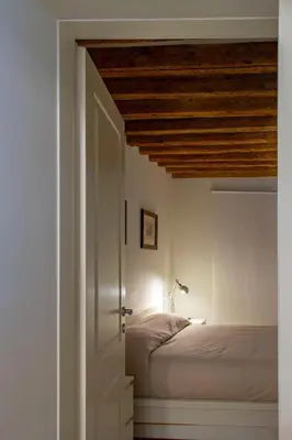 Letto o letti in una camera di Ca Farnese, beautiful big apartment in trad area