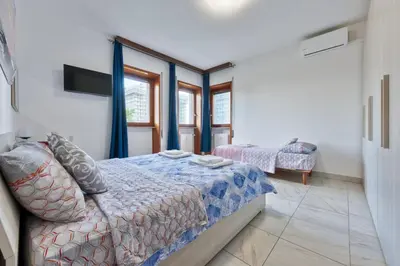 Letto o letti in una camera di Arish Downtown Venice Apartment