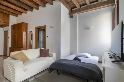 Letto o letti in una camera di i-HOMES Pigafetta Apartment