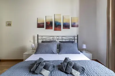 Letto o letti in una camera di i-HOMES Pigafetta Apartment
