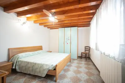 Letto o letti in una camera di Dimora Sara-Isola di Pellestrina VE