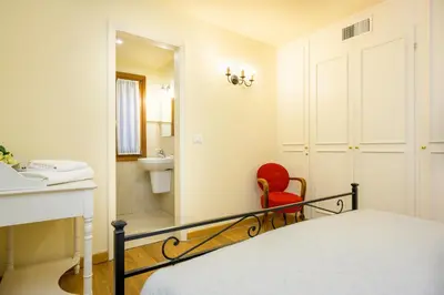 Letto o letti in una camera di Ca' Frezzeria by Sarlux