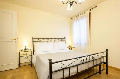 Letto o letti in una camera di Ca' Frezzeria by Sarlux