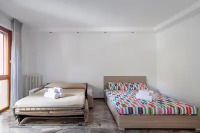 Letto o letti in una camera di GuestHost - Padova cozy apartments near the Hospital