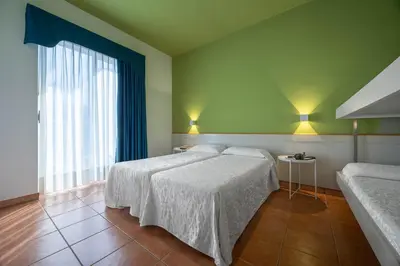 Letto o letti in una camera di Hotel Portofino