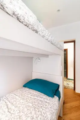 Letto o letti in una camera di Casa MammaMarisa
