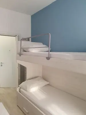Letto o letti in una camera di Casa Azzurra Zona Bau Bau Beach