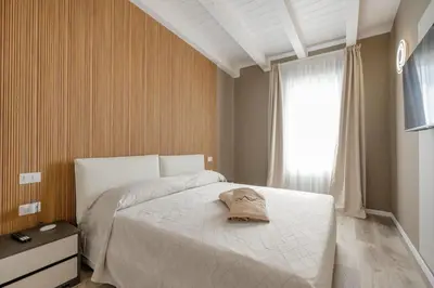 Letto o letti in una camera di Wave Island G - Home Immobiliare