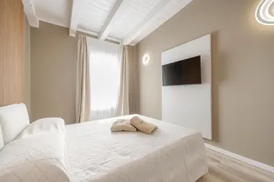 Letto o letti in una camera di Wave Island G - Home Immobiliare