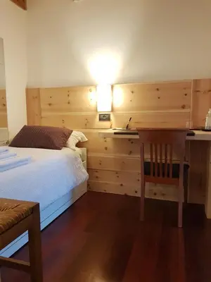 Letto o letti in una camera di B&B Melograno MC