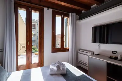 Letto o letti in una camera di GuestHost - Santo 86 Luxury Rooms
