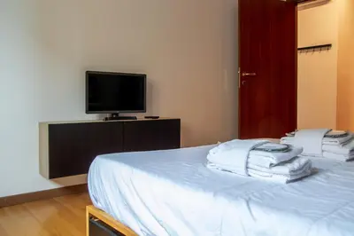 Letto o letti in una camera di Welc-ōM Urban Nest Padova