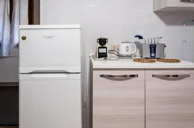 Cucina o angolo cottura di room with private bathroom Stella 1