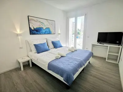 Letto o letti in una camera di Jesolo Pineta Fronte Mare - Jl Blue Apartments C25